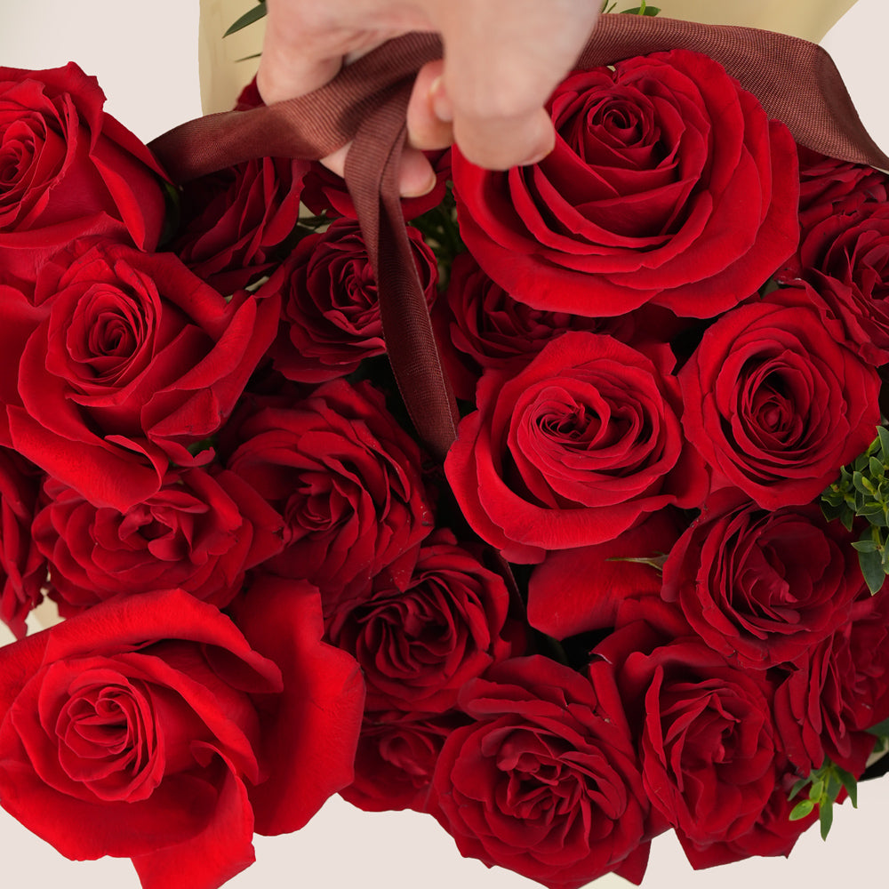 luxury red rose cone bouquet in burgundy gift bag valentine flowers uae