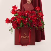 Premium Red Roses Bouquet in Burgundy Gift Bag – Valentine’s Day Flower Delivery in UAE