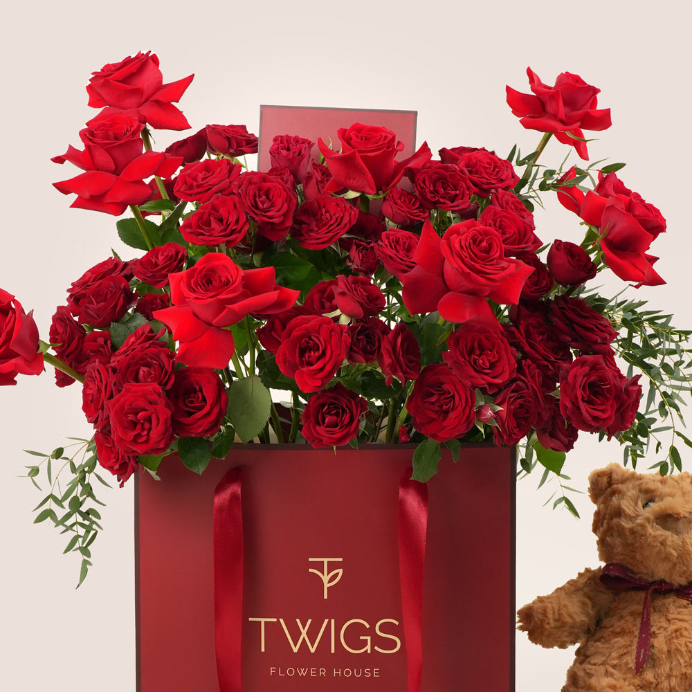 Red Roses Bouquet in Chic Gift Bag with Teddy – Valentine’s Day Flower Delivery in UAE