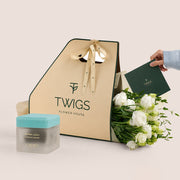 White lisianthus bouquet with Dokhoon Salama bakhoor jar by Carmen Perfumes Dubai