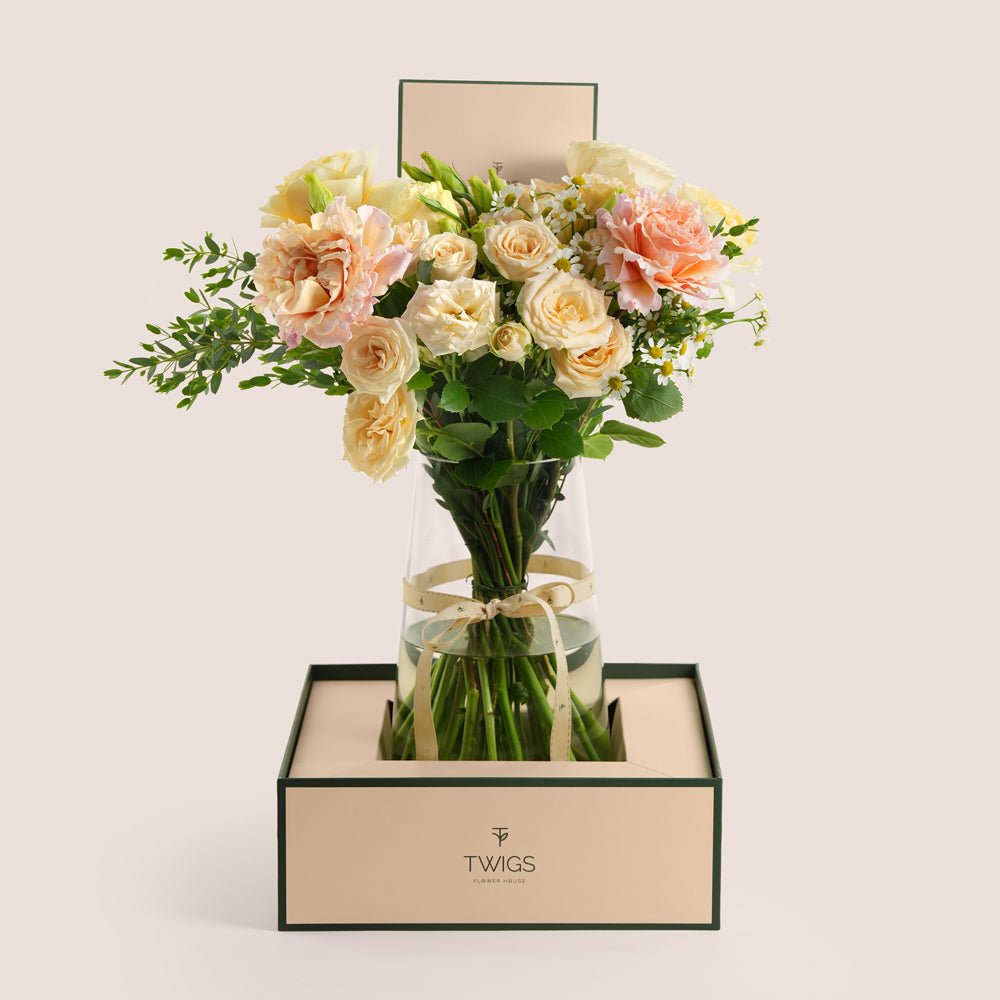 Pastel rose and lisianthus tall vase arrangement in TWIGS beige gift box — Eid Al Adha flower delivery Dubai