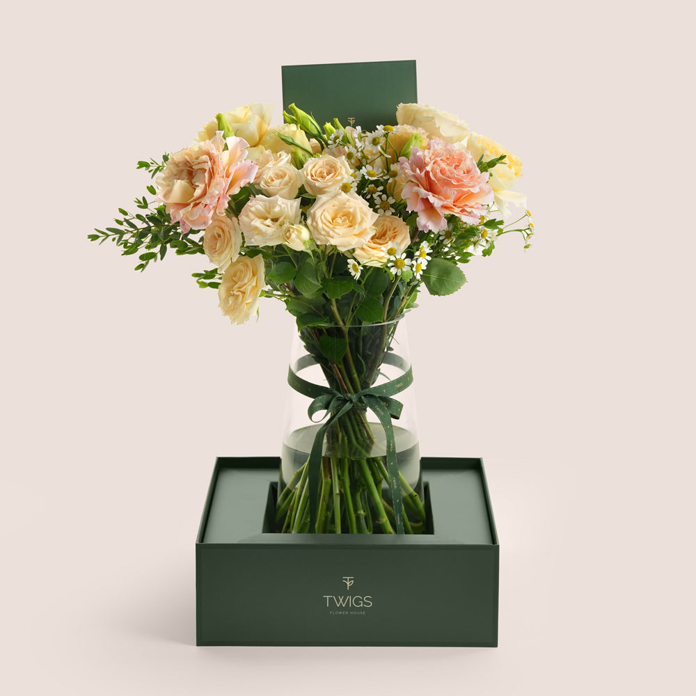 Blush and cream rose vase in TWIGS forest green signature box — same-day Eid flower delivery UAE
