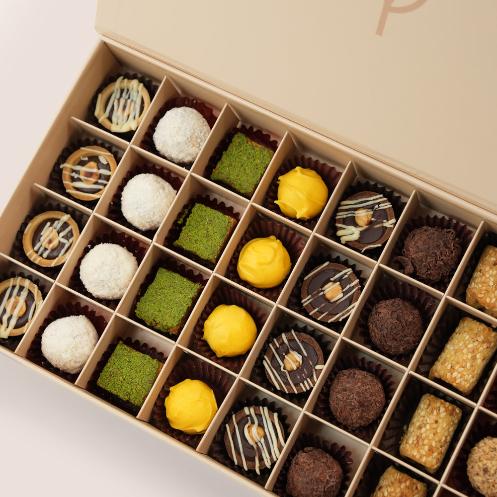 Safa & Truffles Tall Vase Arrangement & Premium Truffles · Petite Fours Assortment · Eid Al Adha Gift Set