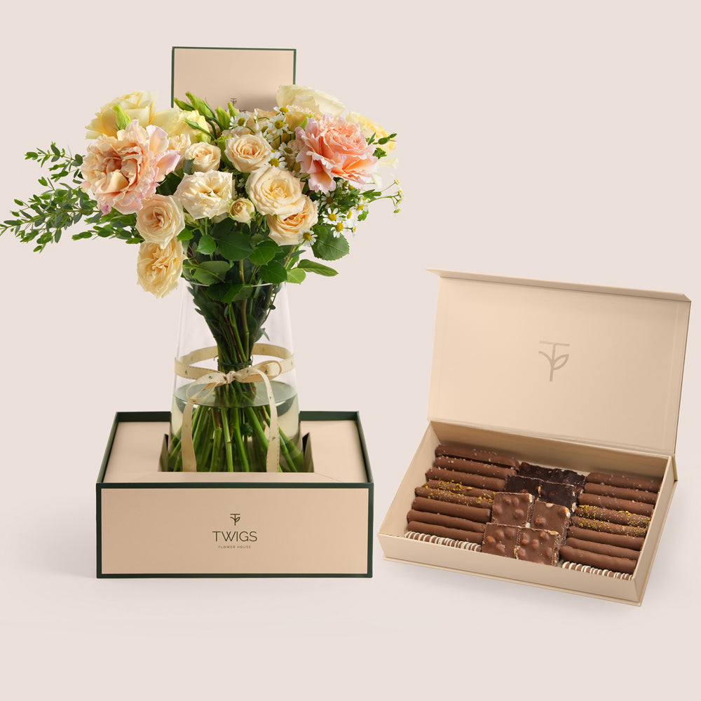 Pastel rose vase arrangement and artisan chocolate box in TWIGS beige gift packaging — Eid Al Adha gift set Dubai