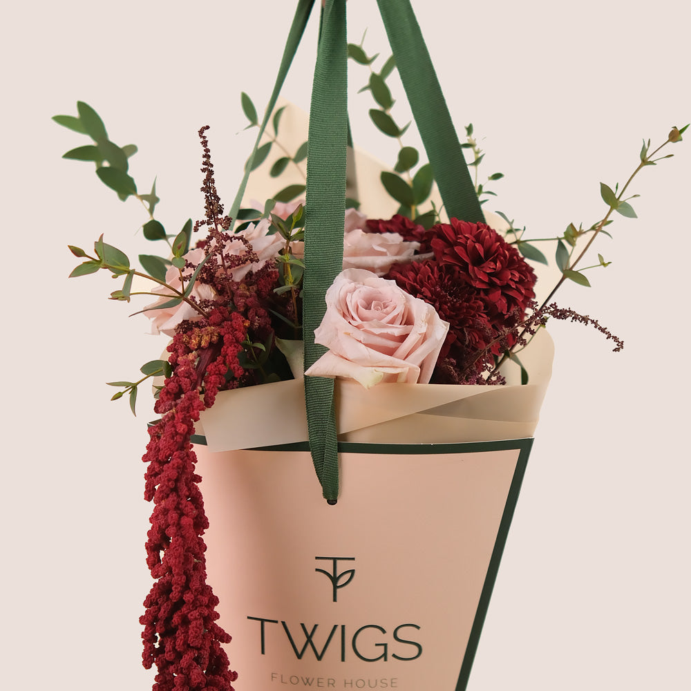 Manar’s Choice – Burgundy & Neutral Flowers Hand Bouquet in TWIGS Cone Bag