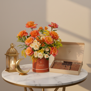 Luxury Ramadan flower arrangement with orange Ecuador roses paired with TWIGS signature chocolate gift box – UAE same-day delivery