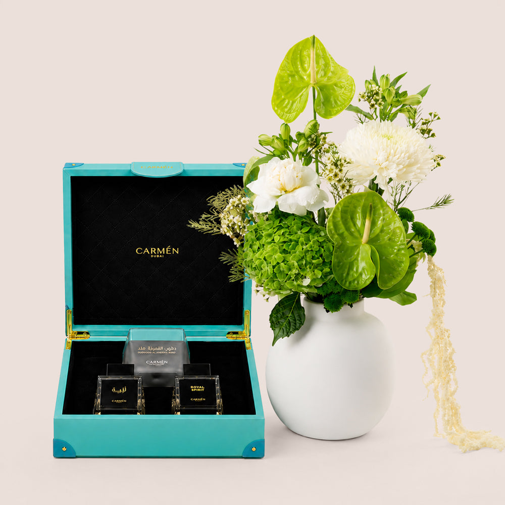 Green and white botanical vase arrangement with Carmen Gift Box Season perfume set