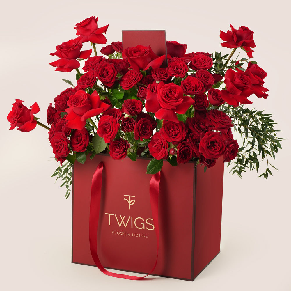 premium red roses gift bag bouquet with teddy twigs flower house