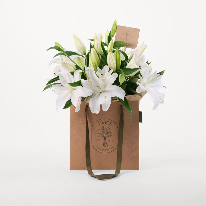Lilies White Flowers Bouquet In A Bag
