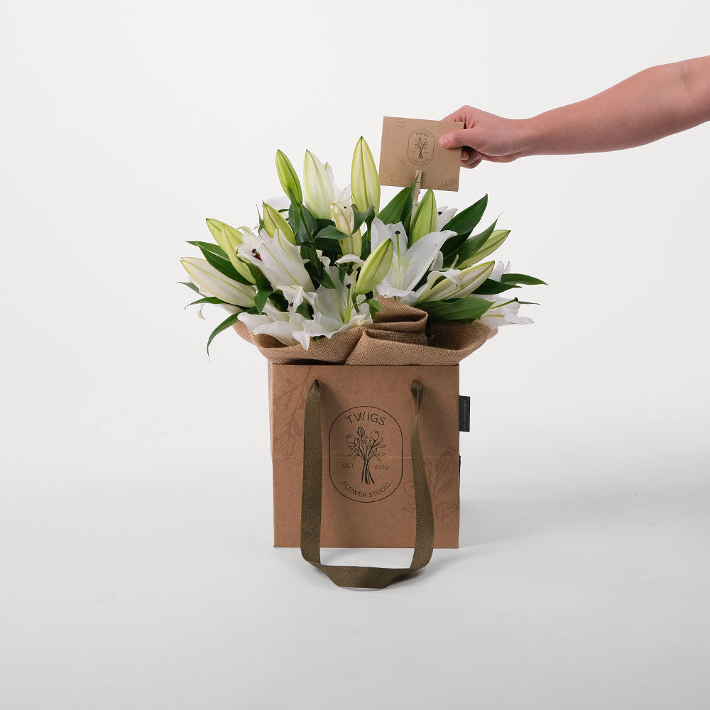 Lilies White Flowers Bouquet In A Bag